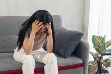 Recession Stress Woman using laptop work hard at home office headache, depressed from failure business burnout. Tired Asian woman despair stress, overworked, pain sadness life problems frustration