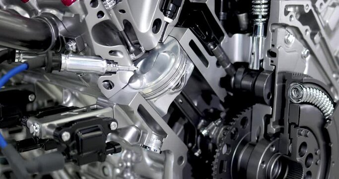 Close up view of shiny new automotive engine cut section.