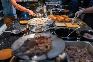 Guests staying at the hotel are coming to the breakfast section to get their food. There are many menus to choose from from professional chefs such as fried eggs, bread, desserts, soups, fried foods.