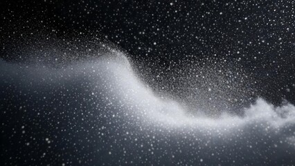  Snowflakes falling in a flurry against a dark sky