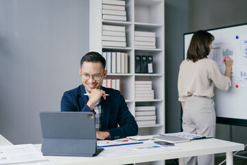 Obraz premium Business Meeting in Modern Office with Professional Team Collaborating on Project and Analyzing Data