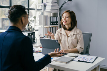 Professional Business Meeting in Modern Office with Smiling Female Executive and Male Colleague