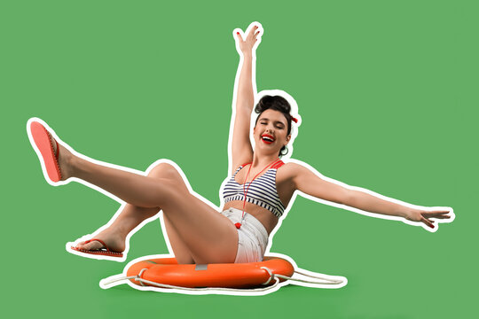 Young pin-up lifeguard with ring buoy sitting on green background