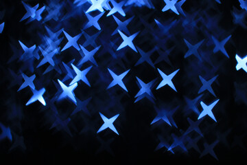 Abstract dark background with large navy blue and white stars