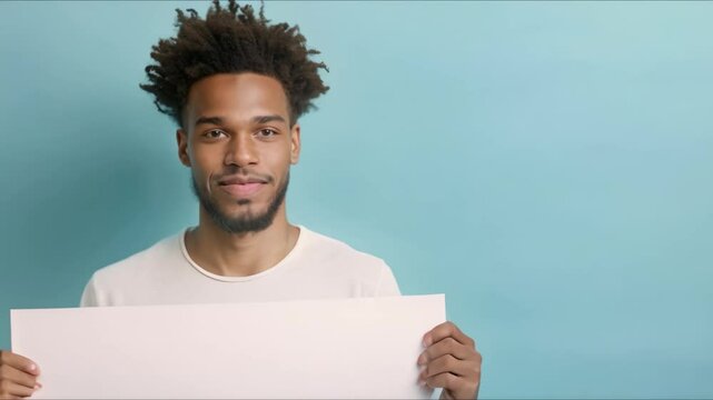 A confident African American man holds a blank sign against a blue backdrop. Concept Portrait Photography, African American Model, Blank Sign, Blue Background, Confidence