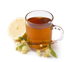Cup of linden tea with leaves, flowers and lemon on white background