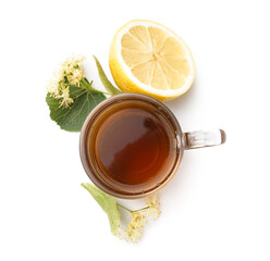 Cup of linden tea with leaves, flowers and lemon on white background
