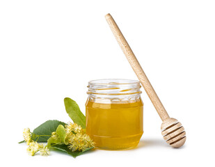Jar with linden honey and dipper on white background