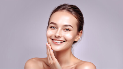 Woman smiling while touching her flawless glowy skin with copy space for your advertisement, skincare