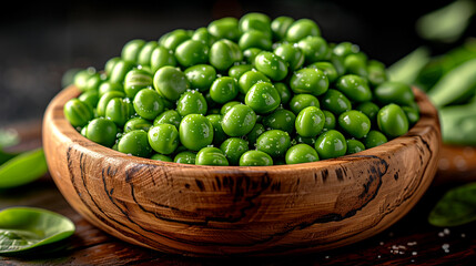 A bowl of green peas is sitting on a wooden table. The peas are fresh and appear to be ready to be eaten