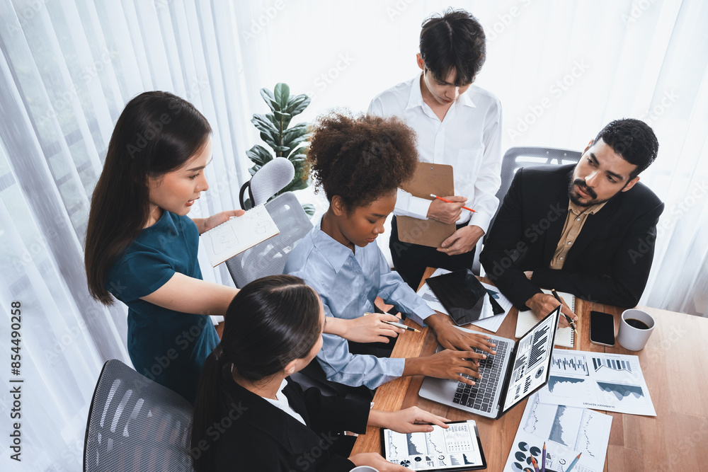 Poster multiracial analyst team use bi fintech software to analyze financial data on meeting table. financi