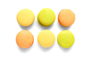 Different tasty sweet macaroons on white background