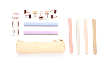 Beige pencil case and different school stationery on white background