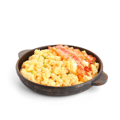 Frying pan of tasty scrambled eggs with bacon on white background