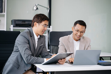 Portrait of success business people working together in modern office. Couple teamwork startup concept
