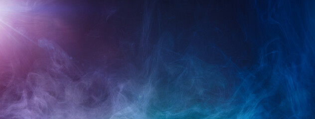 カラフルな光に浮かび上がる煙の背景テクスチャー