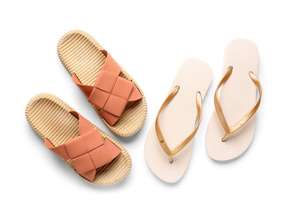 Colorful pairs of female flip flops on white background