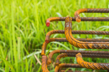 Carbon steel rebar that has been corroded due to exposure to the weather, concept of quality control