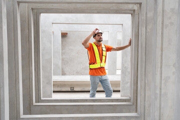 Portrait Hispanic latin engineer man checking precast cement at precast cement outdoor factory	