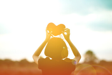 girl hands holding hearts silhouette