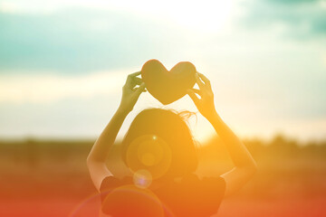 girl hands holding hearts silhouette