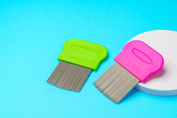 Comb for lice removing on blue background