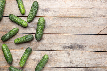 Fresh cucumbers on wooden background