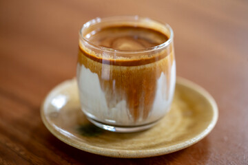 Close up photo of dirty coffee on wooden table