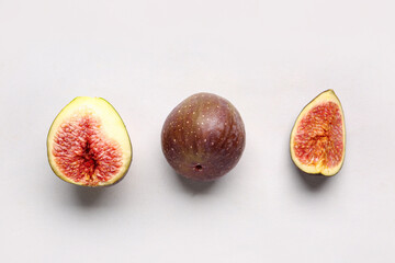 Fresh ripe figs on lilac background