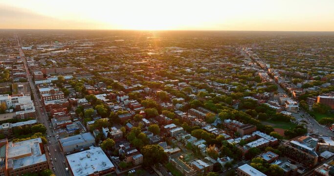 Aerial view of residential houses at summer sunset neighborhood, suburb. Real estate, drone shots, sunlight, from above.