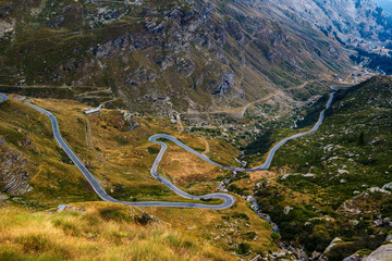 Alpine serpentine road in the valley in the mountains in Italy.