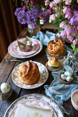 Reserved table with homemade cakes and flowers, rustic brunch