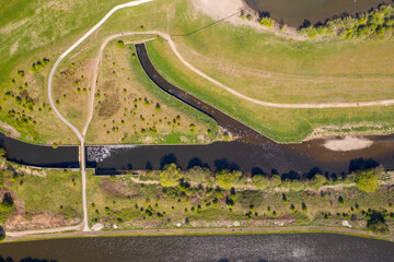 Top down aerial photo in the spring time of a canal and river at the Leeds lake known as Skelton...