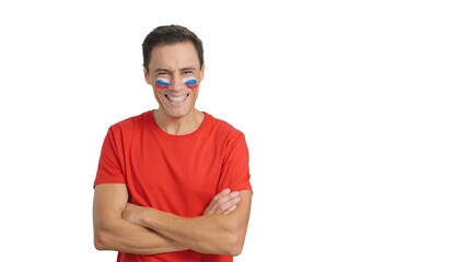 Man standing with russian flag painted on face smiling