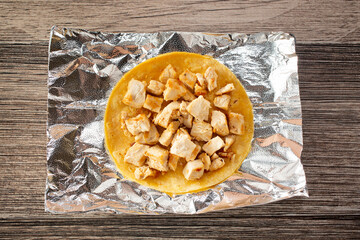 A top down view of a chicken taco.