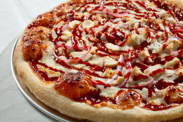 A closeup view of a BBQ chicken pizza.