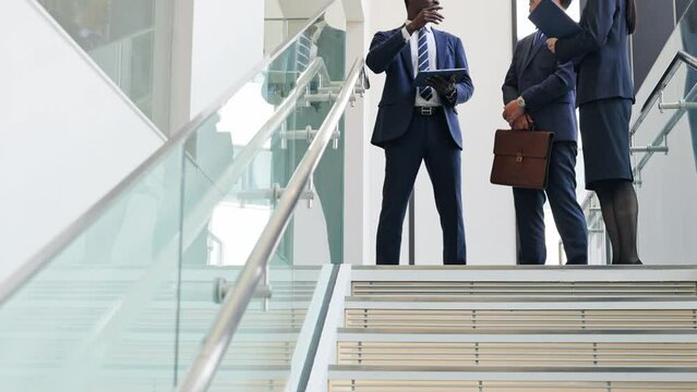 Group of multinational business people having a conversation in a lobby