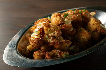A view of a deep fried cauliflower appetizer dish.