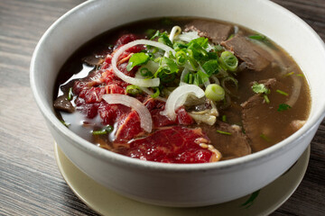 A view of a combo beef pho bowl.