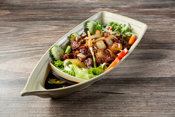 A view of a platter of shaking beef.