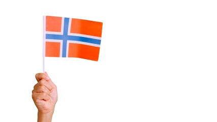 Wind waving a norwegian pennant holding by a hand