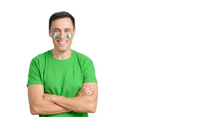 Man standing with nigerian flag painted on face smiling