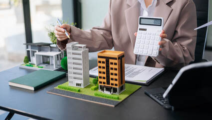 balancing the property sector The real estate agent is explaining the house style to see the house...
