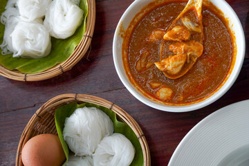 Thai Rice Noodles with crab and coconut milk in red curry in Ayutthaya Province, Thailand. Photographed in October 2023.