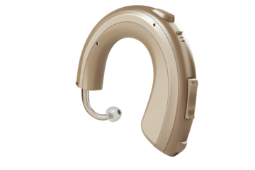 Digital beige hearing aid isolated on white background. Assistive listening device for people with hearing loss.