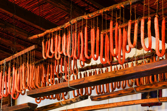 sobrasadas hanging in the drying room, Cal Dimoni, restaurant. Algaida. Mallorca. Balearic Islands. Spain.