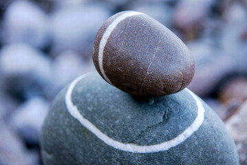 circular stone in balance, Es Carregador beach, Port des Canonge, Natural area of ​​the Serra de Tramuntana, Majorca, Balearic Islands, Spain