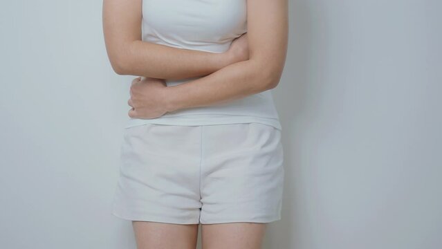 woman having abdomen ache due to Stomach pain, digestion with constipation or Diarrhea from food poisoning, female problem and Endometriosis, Hysterectomy and Menstrual