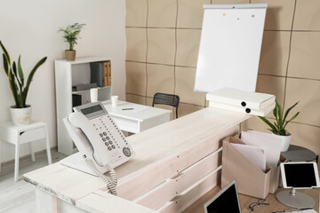 Telephone on reception desk in modern clinic, closeup