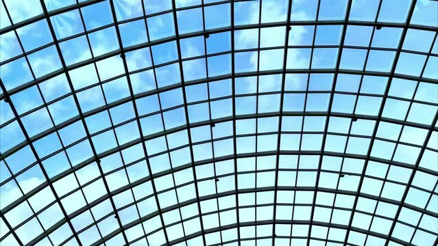 Glass ceiling of a modern building. Architectural background. Glass dome from inside at skyscraper.